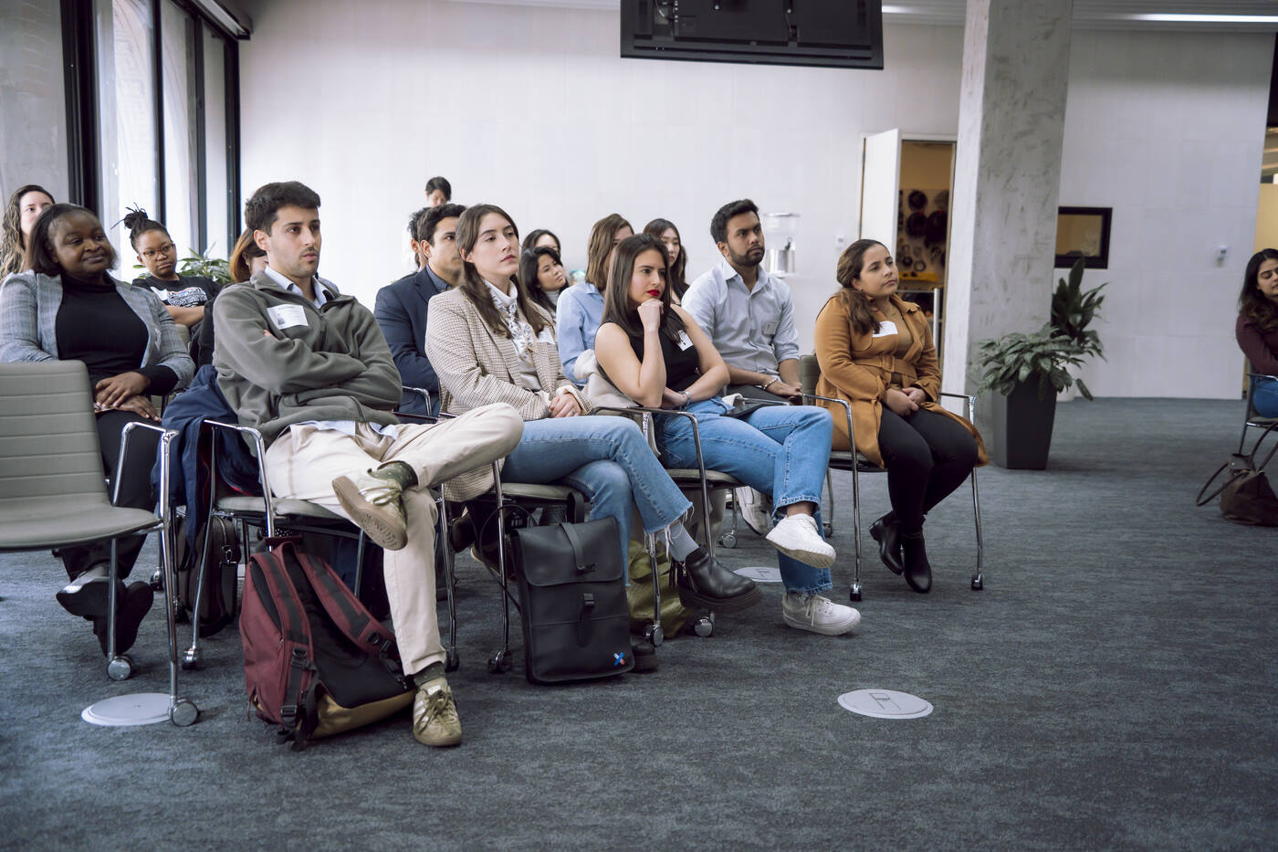 Students listening to a session