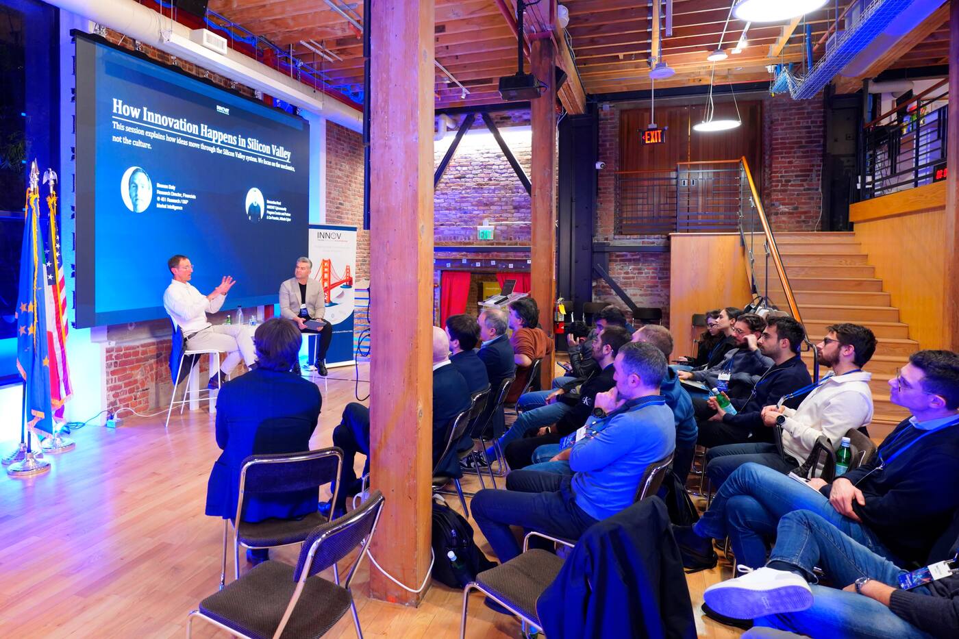 Panel in a brick-walled hall