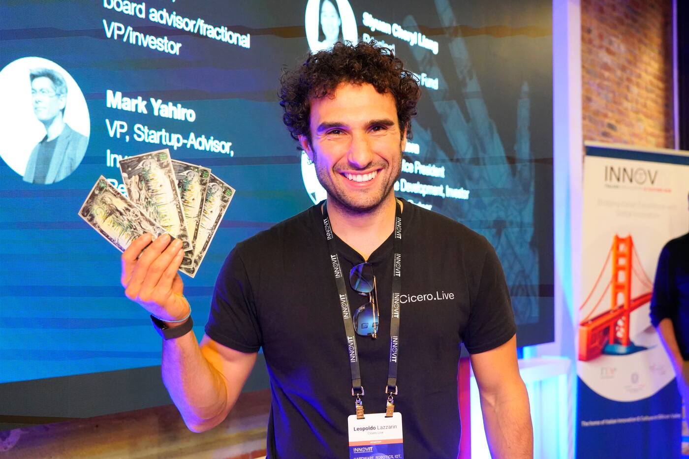 Founder fanning prop cash at a shark tank night