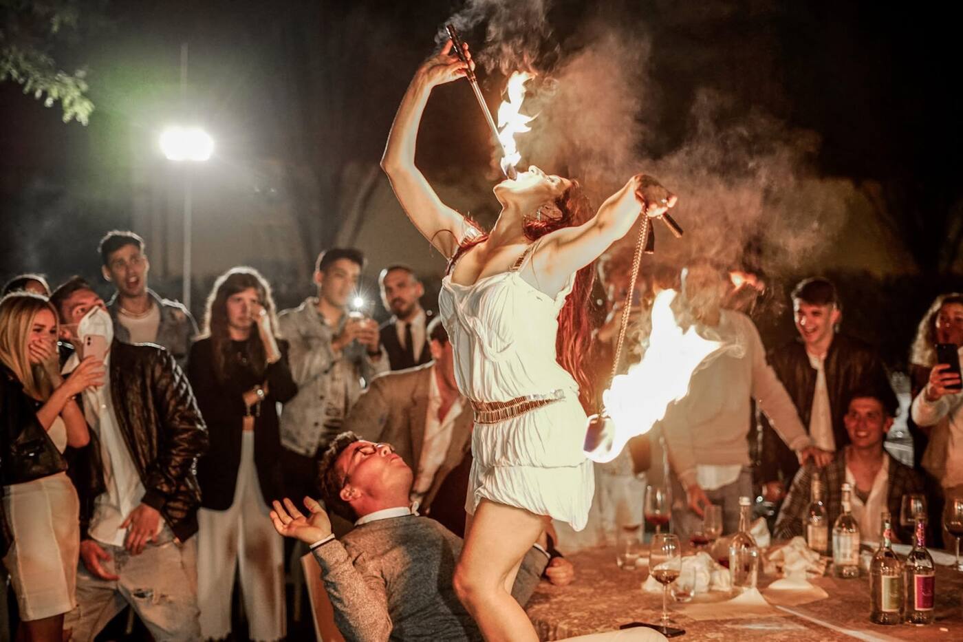 Fire-eater performing between courses