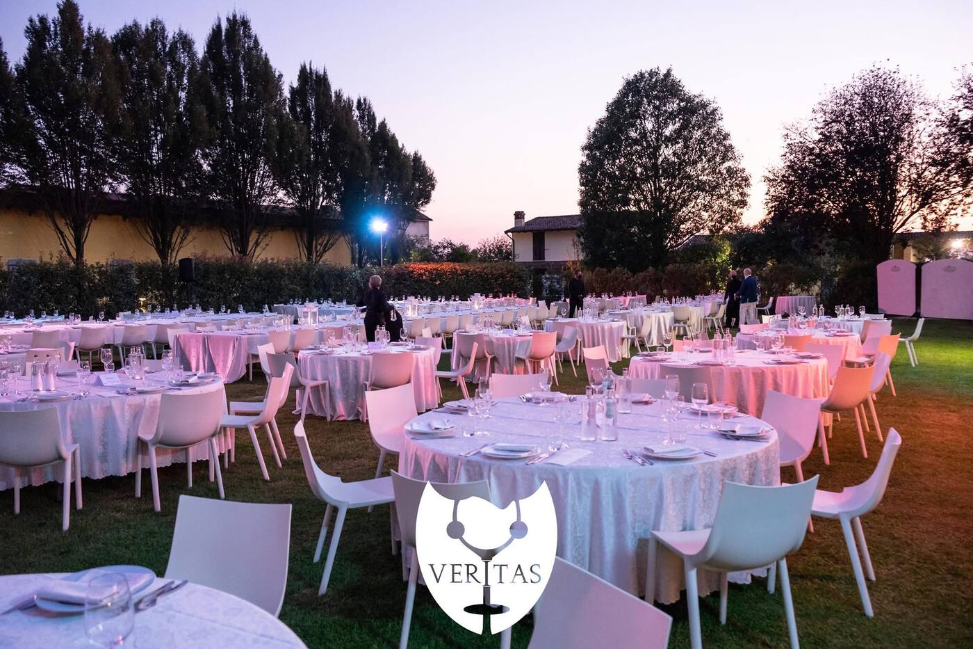 Tables lit pink at dusk